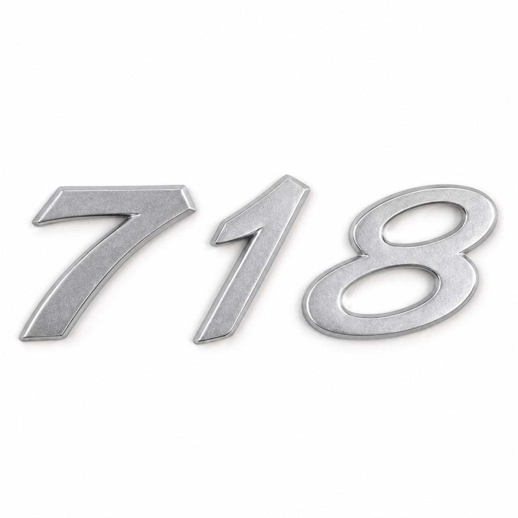 Silver-coloured aftermarket 718 badge set