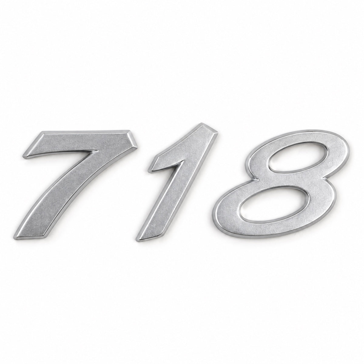 Silver-coloured aftermarket 718 badge set