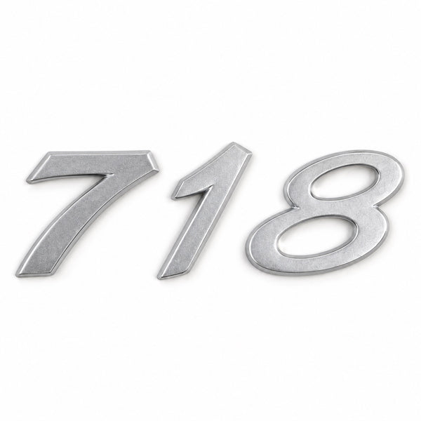 Silver-coloured aftermarket 718 badge set