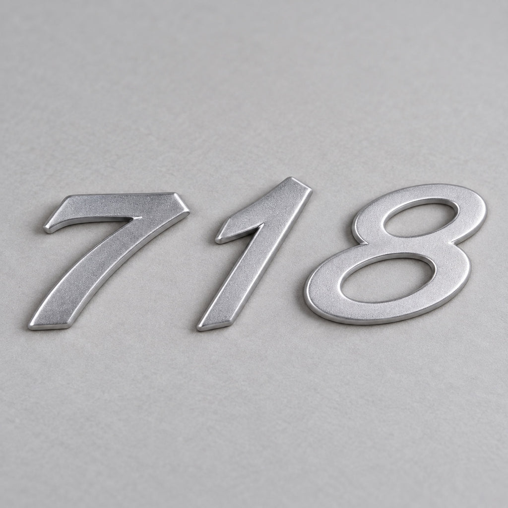 Silver-coloured aftermarket 718 badge set