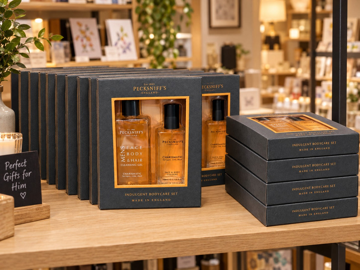 Twelve Charismatic bodycare sets displayed on a gift-shop shelf (styled image)