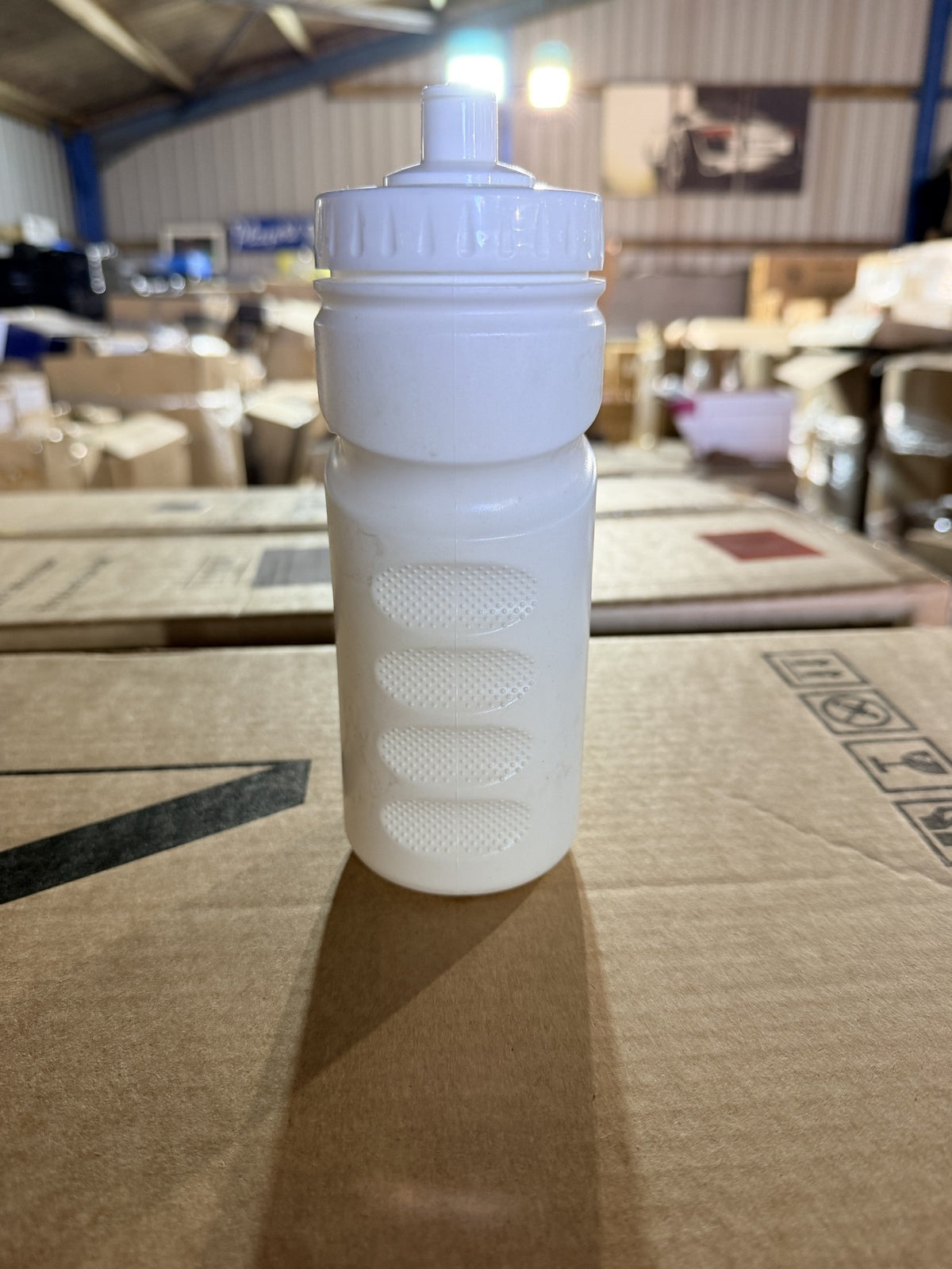 Real photo: back of the bottle showing the four textured grip pads