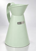 Charles Bentley heritage metal jug in pale sage green, studio photo