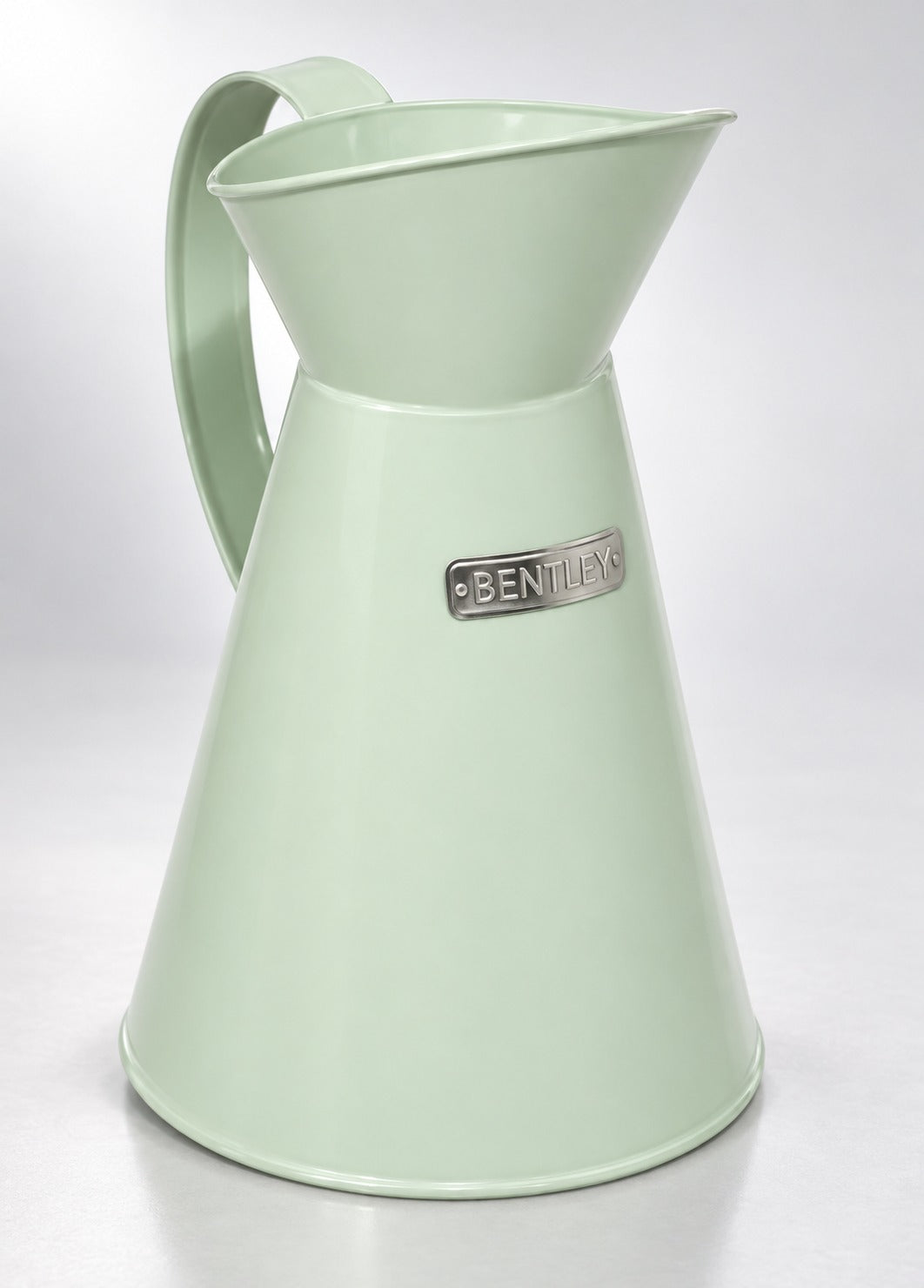 Charles Bentley heritage metal jug in pale sage green, studio photo