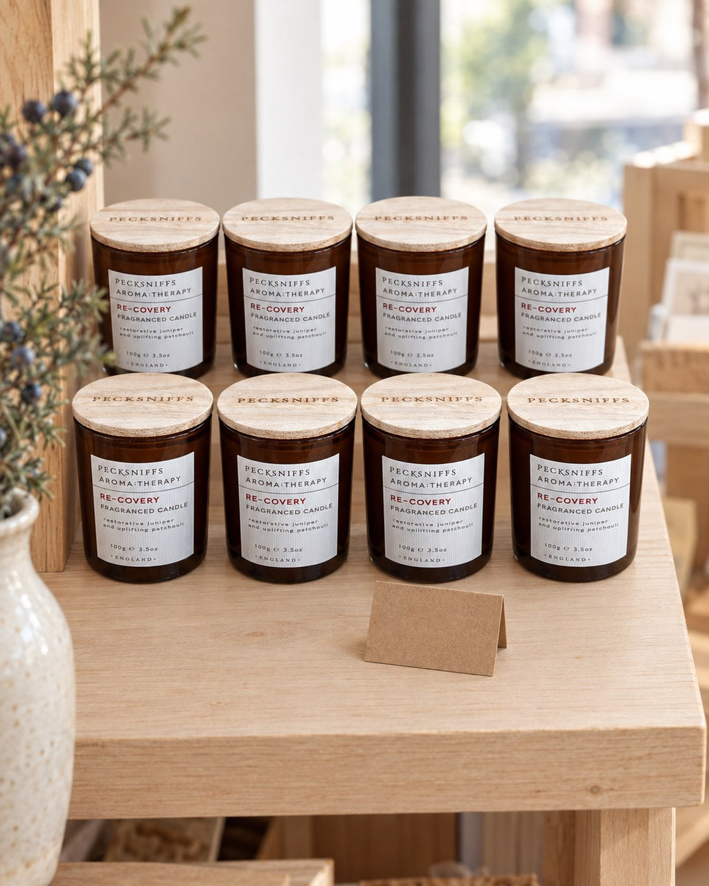 Re-Covery candles displayed on a gift-shop shelf (styled image)