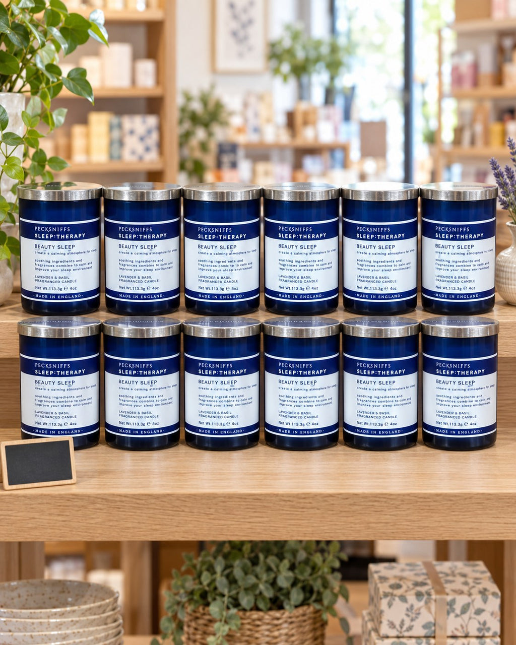 Twelve Beauty Sleep candles displayed on a gift-shop shelf (styled image)