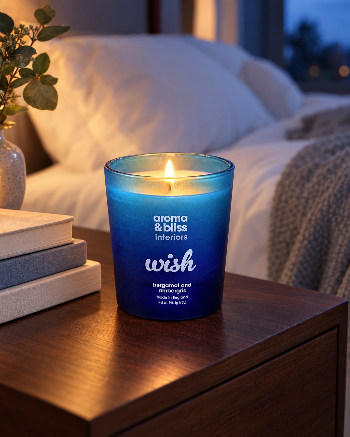 Wish candle lit on a bedside table (styled image)