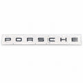 Black aftermarket Porsche seven-letter badge set in packaging
