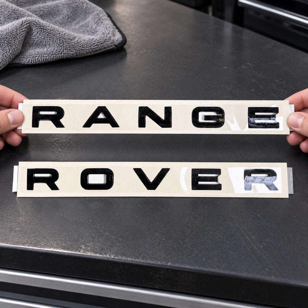 Gloss black aftermarket Range Rover lettering set on fitting stencil