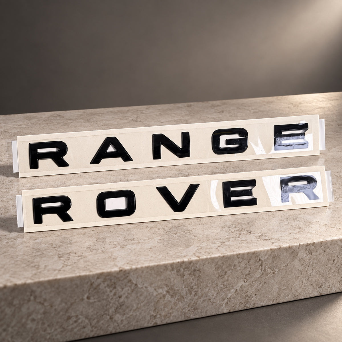 Gloss black aftermarket Range Rover lettering set on fitting stencil