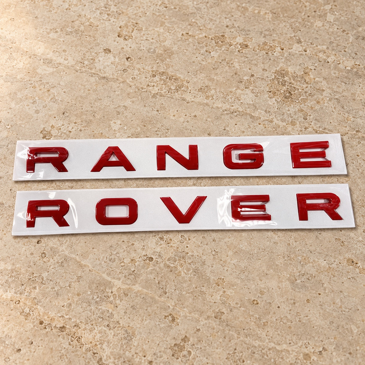 Gloss red aftermarket Range Rover lettering set on fitting stencil