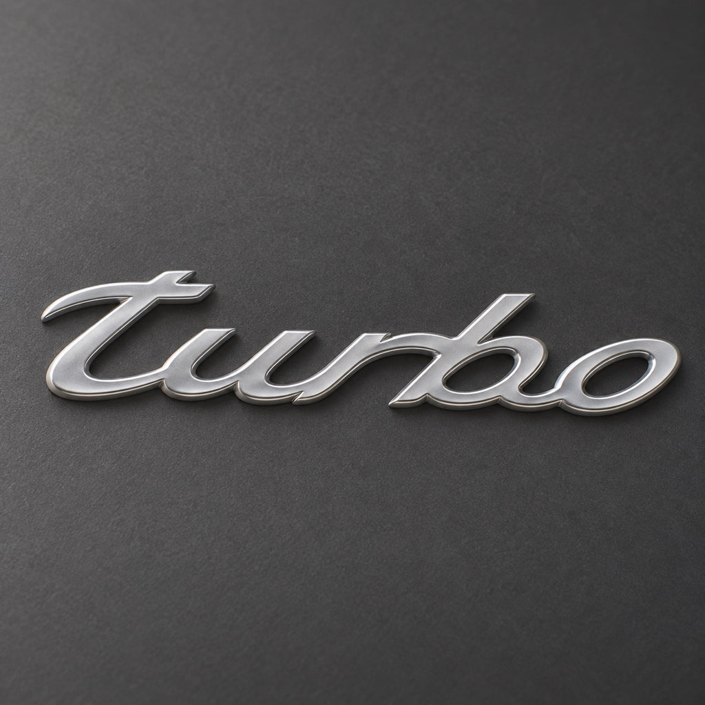 Silver-coloured aftermarket turbo script badge