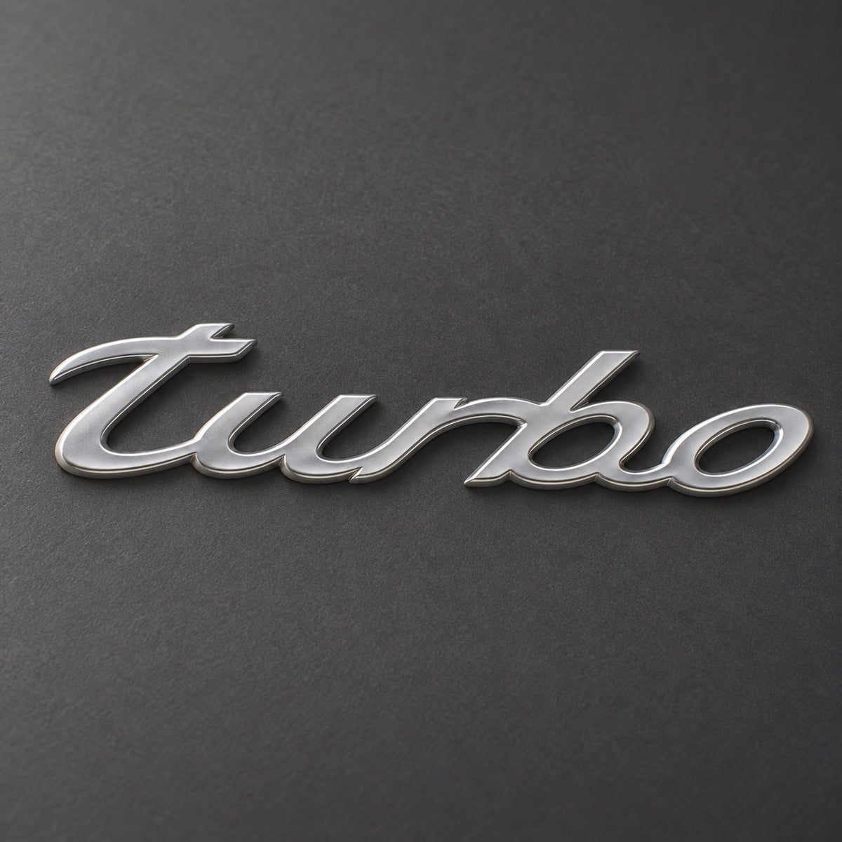 Silver-coloured aftermarket turbo script badge
